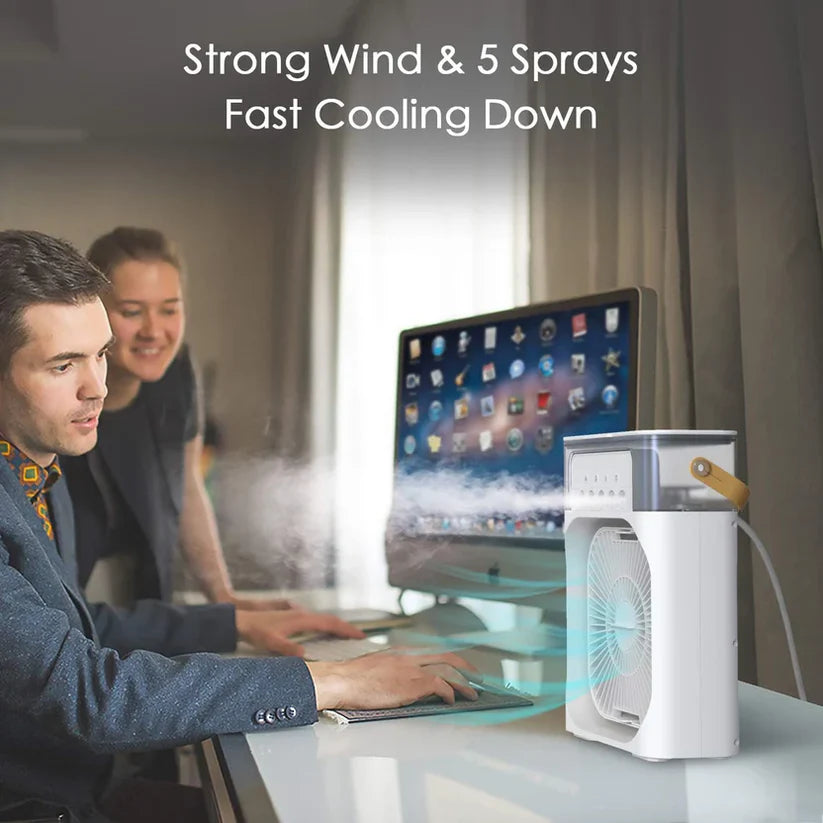 Mini portable AC cooling fan on office desk